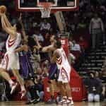 NBA Basketball player Yao Ming throws basketball in hoop.
