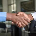Shaking hands on a business deal.