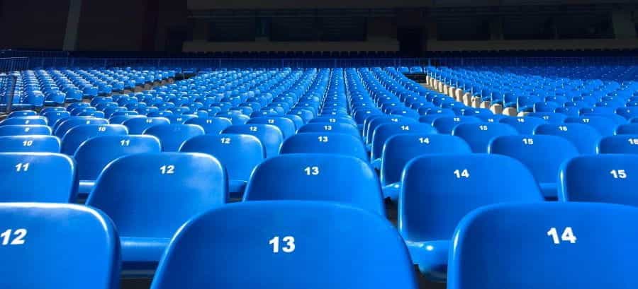 Rows of empty stadium seats.