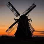 A windmill in Holland at sunset.
