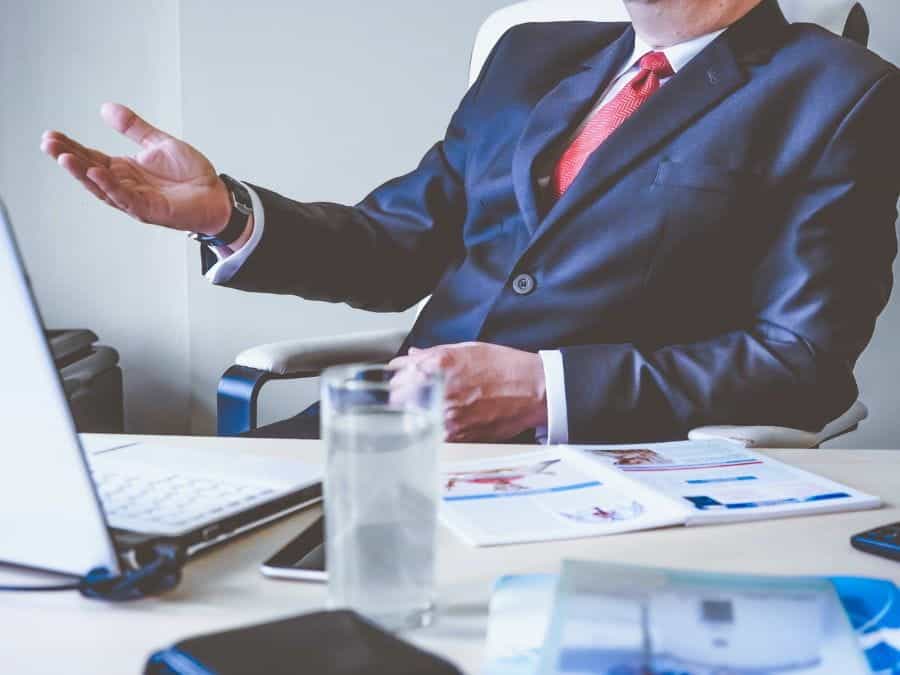 A businessman sitting at his office desk.