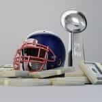 An NFL helmet sits atop stacks of cash beside trophy.