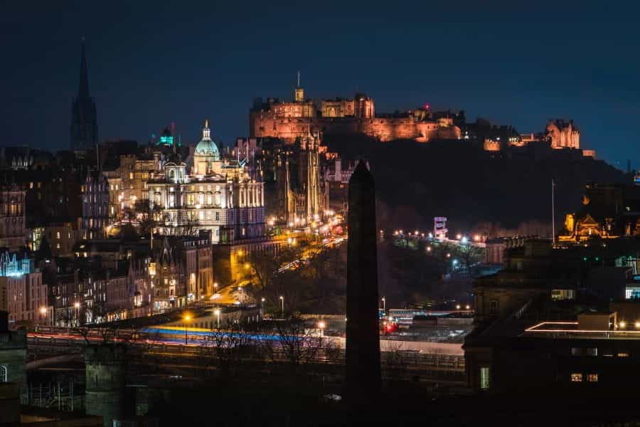 Edinburgh city lit up at night.