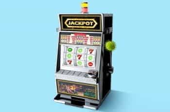 A casino slot machine with coronavirus symbols.