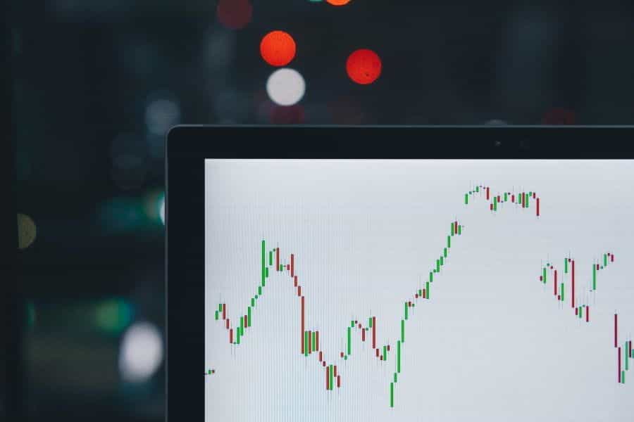 A graph of climbing stock prices on laptop screen.