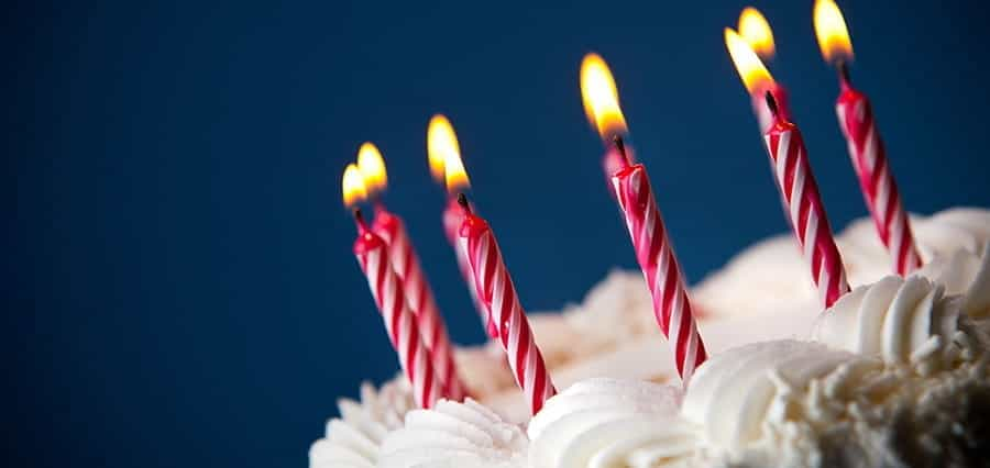 Candles atop a birthday cake.