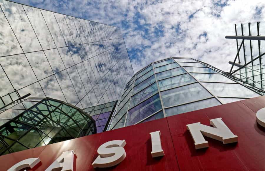The outside of a glass casino building.