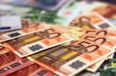 A pile of Euro banknotes.