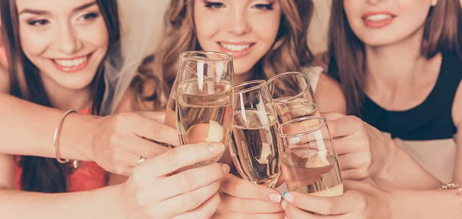 Women toasting with champagne.