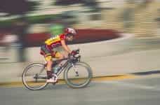 A man racing on a bike.