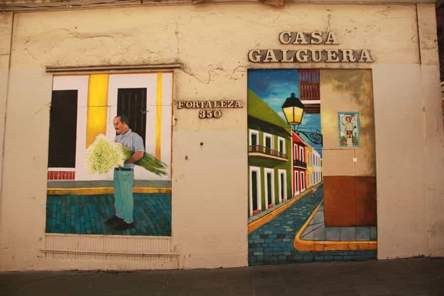 Two colorful murals on a wall reading CASA GALGUERA in San Juan, Puerto Rico.