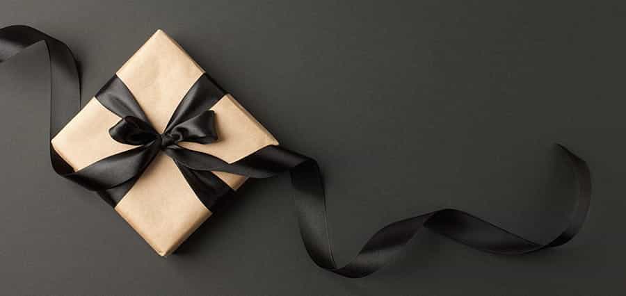 A present, wrapped in wrapping paper and ribbon.