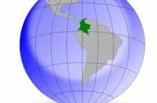 A graphic of the globe, with the country of Colombia shaded in Green.