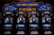 A brightly-lit row of slot machines in Las Vegas, Nevada.