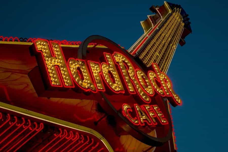 A Hard Rock Café neon sign in the shape of a sky-high guitar.
