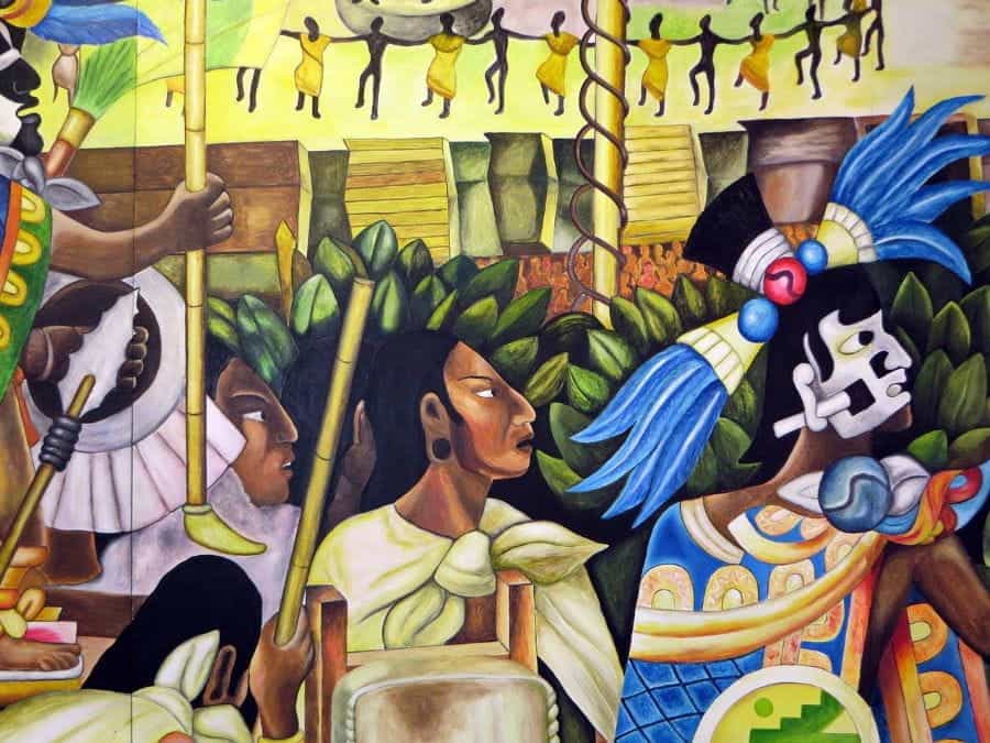 A colorful mural in Mexico featuring Aztec imagery.
