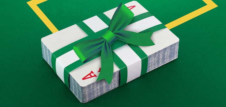 A pack of playing cards, wrapped in a bow.