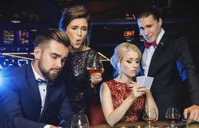 Two men and two women in a casino.