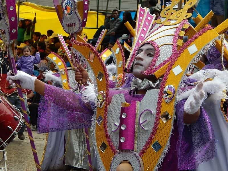 A male dancer wearing a colorful costume during Carnival in Cajamarca, Peru.