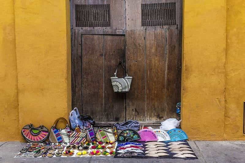 Shoes, purses, and fans for sale on the street in Cartagena, Colombia.