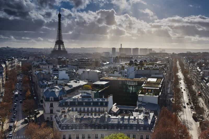 A sprawling view of the French capital city of Paris, with the iconic Eiffel Tower in plain sight.