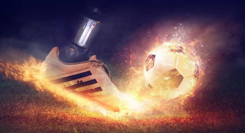 Football being struck.