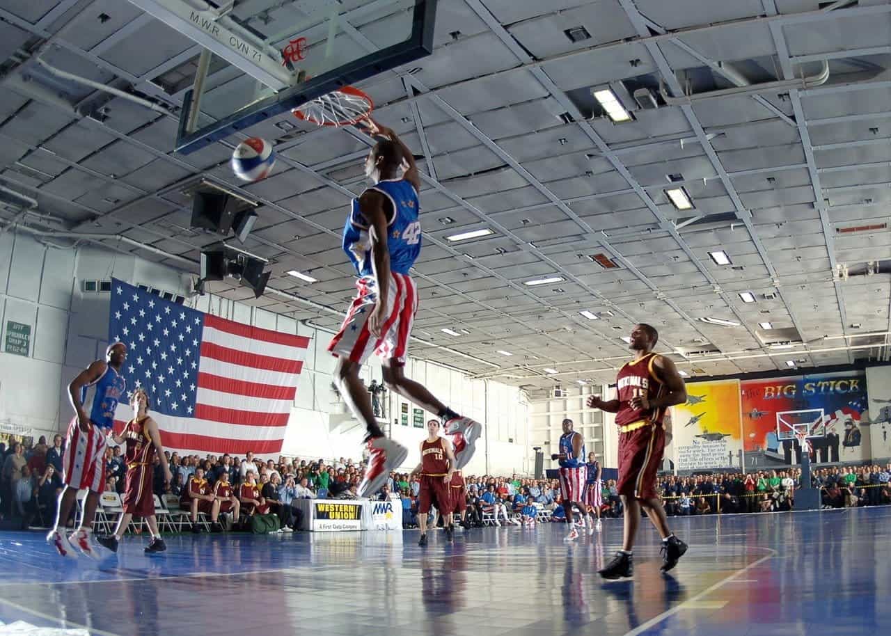 The Harlem Globetrotters play a basketball game on an American court.