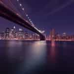 The Brooklyn Bridge at night in New York City, New York, US.