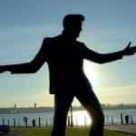 A silhouette of a sculpture of Elvis Presley.