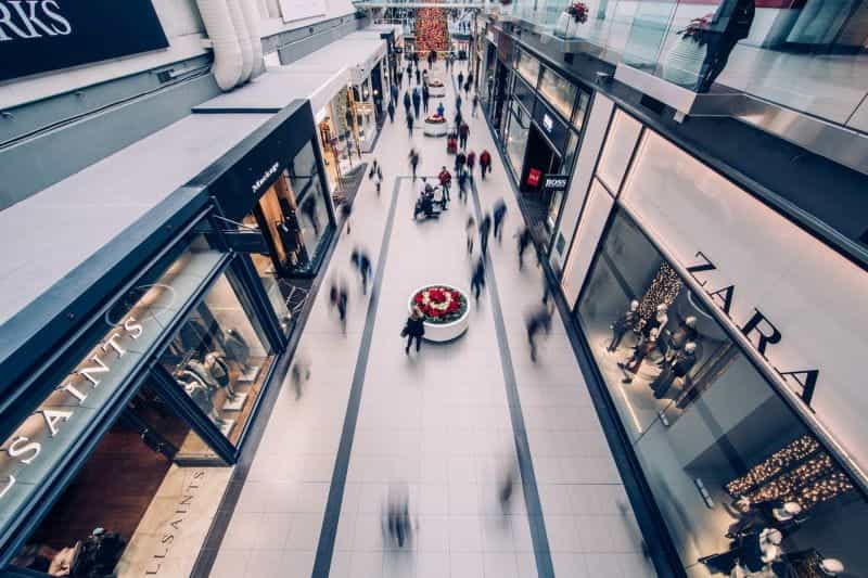 People shopping at a busy shopping mall.