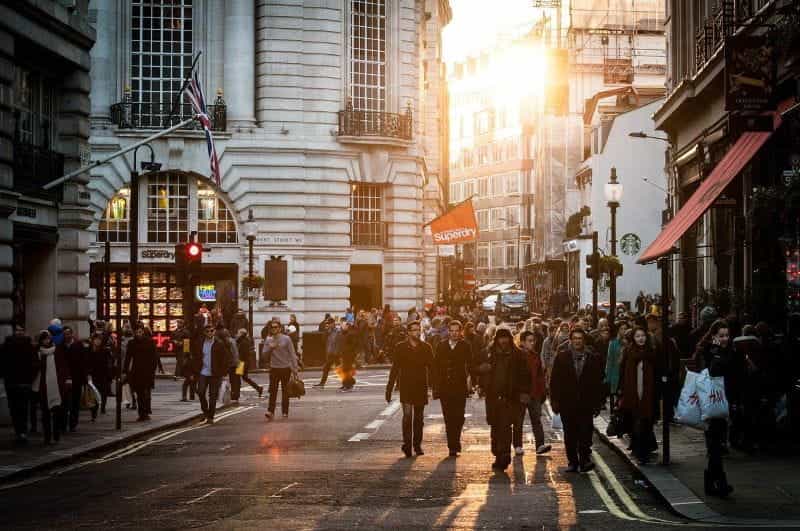 A crowd of shoppers on a busy UK high street.
