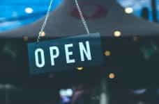 A shop door sign that says OPEN.