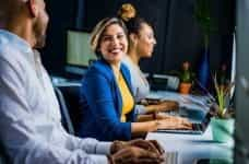 Men and women working in an office.