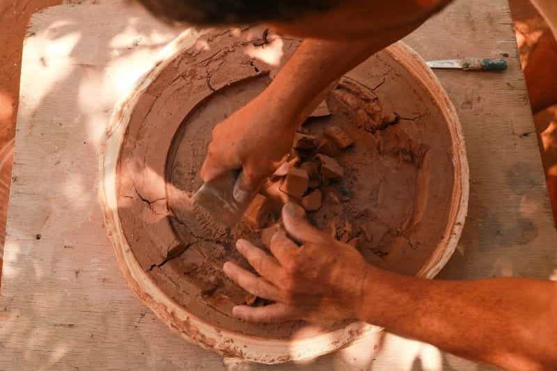 A craftsman works with mud clay in Aregua, Paraguay.
