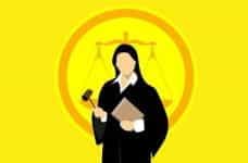 A graphic of a female judge standing before weighted scales.