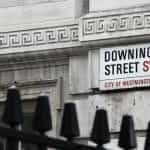 A sign that says Downing Street SW1 City of Westminster, where the Prime Minister lives.