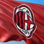 The flag and official logo of the football team AC Milan.