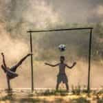 Children playing football.