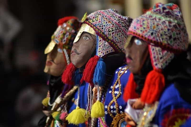 A row of colorful dolls dressed for the Carnival in Cusco, Peru.