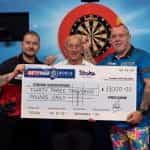 Dimitri Van den Bergh, Fred Done and Peter Wight holding a £33,000 charity check.