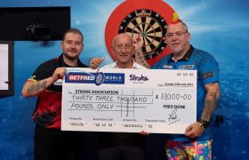 Dimitri Van den Bergh, Fred Done and Peter Wight holding a £33,000 charity check.