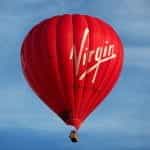 A red colored hot air balloon with the Virgin logo.