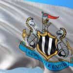 A white flag with the Newcastle United football club crest.