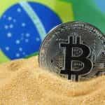 A Brazilian coin sits in front of the flag.