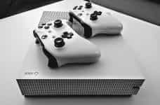 An Xbox with two controllers.