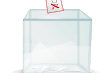 A see-through ballot box with a marked ballot paper being dropped into it.