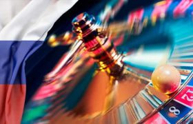 A roulette table next to the Russian flag.