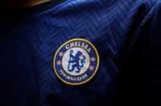 Chelsea Football Club logo on a player's shirt.