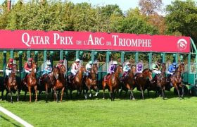 Longchamps starting stalls bursting open.