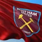 A red flag with the West Ham United football club logo.